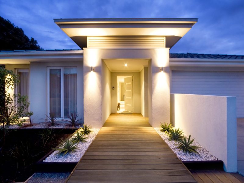 Grand entrance of a contemporary home at dusk